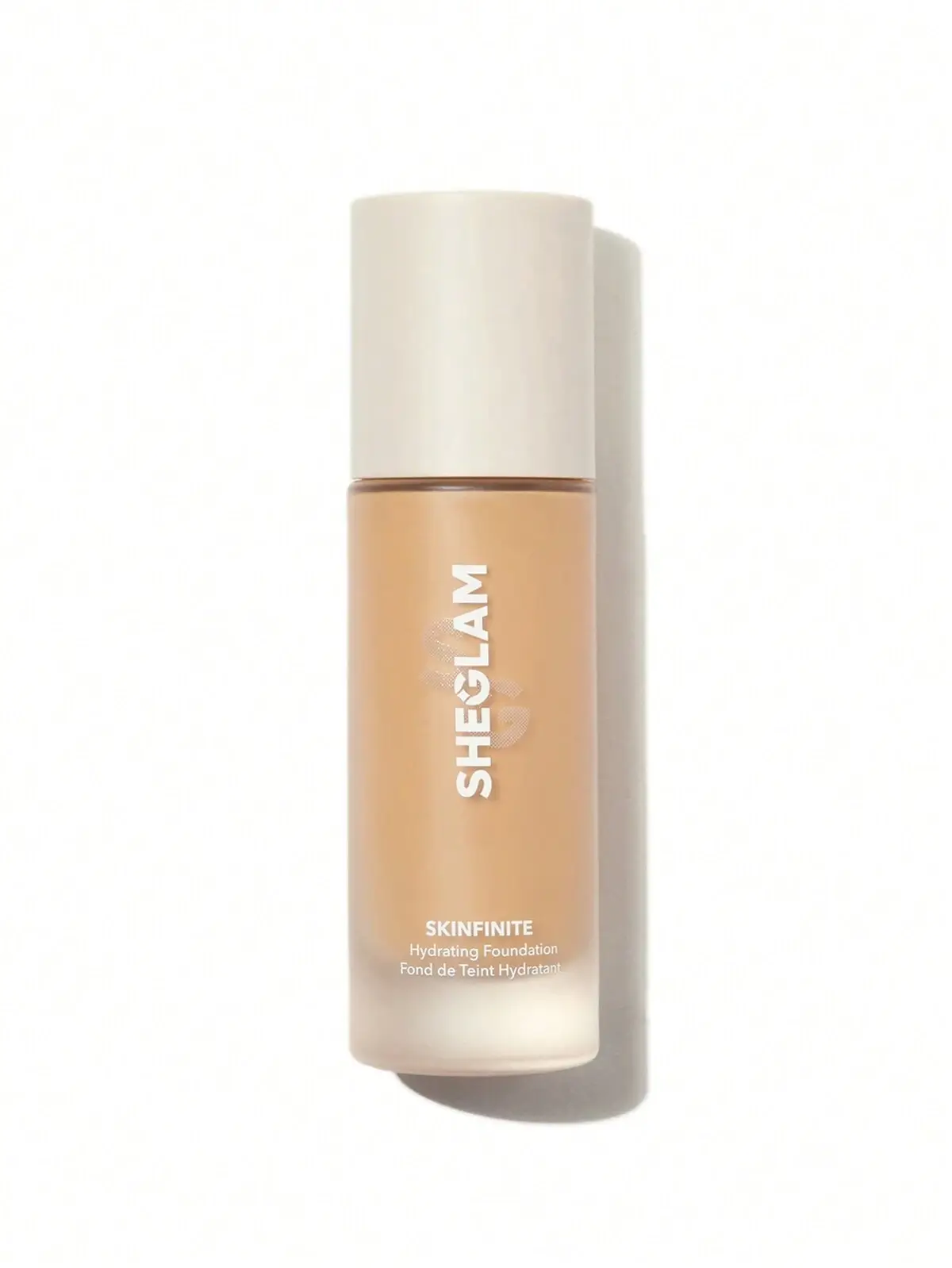 SHEGLAM Skinfinite Hydrating Foundation bottle with beige cap on a white background.